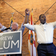 U.S. Sen. Bernie Sanders, I-Vt, left, and Democratic gubernatorial hopeful Andrew Gillum hold hands during a campaign rally Friday, Aug. 17, 2018, in Tampa, Fla.